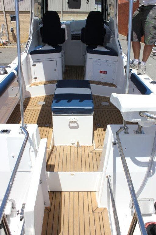 FixTech Fix3 bonding a synthetic teak deck onto fiberglass gel coat boat