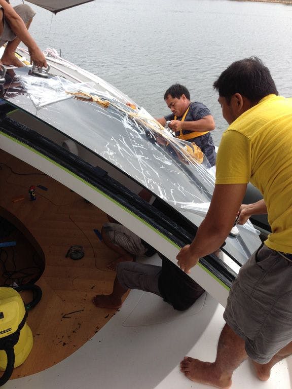 Fixtech Fix190 structural glass bonding, with glass being installed for Adstra Superyacht